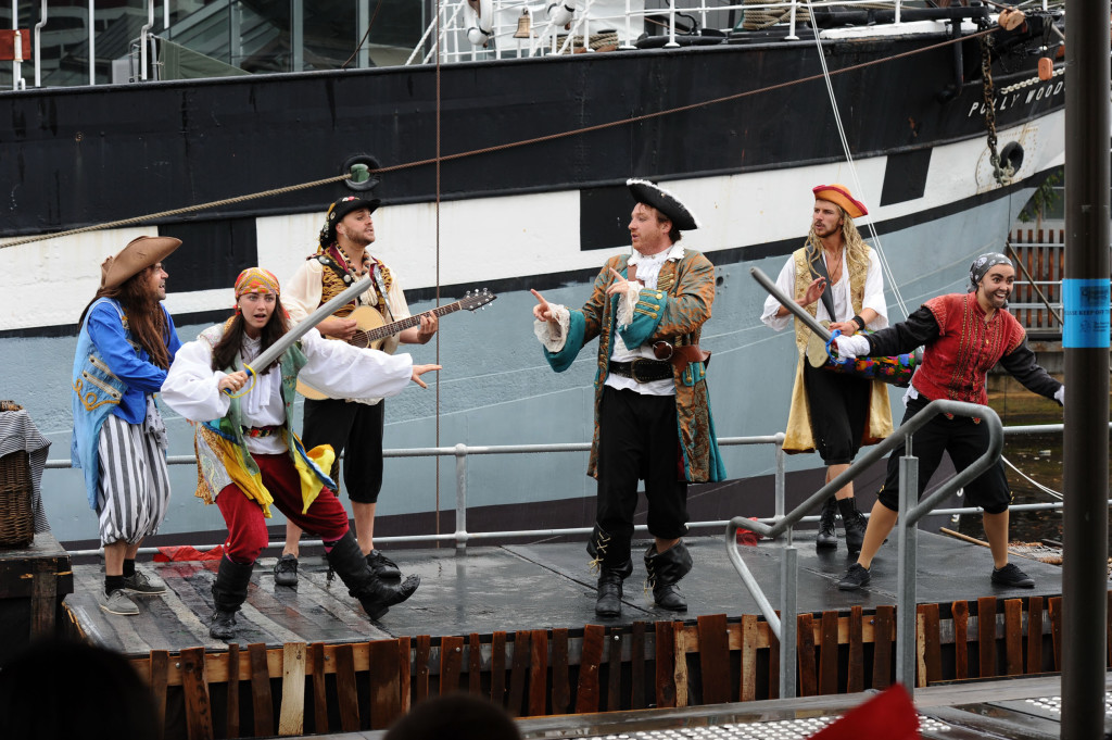 Cast members of from Caribbean Pirates at the Polly Woodside in action – from left Doru Surcel, Christina Marks, Andrew Kroenert, Jon Peck, Caspar Conrick and Lucy Gransbury in action. Image courtesy of Australian Shakespeare Company. Photographer Matt Deller.