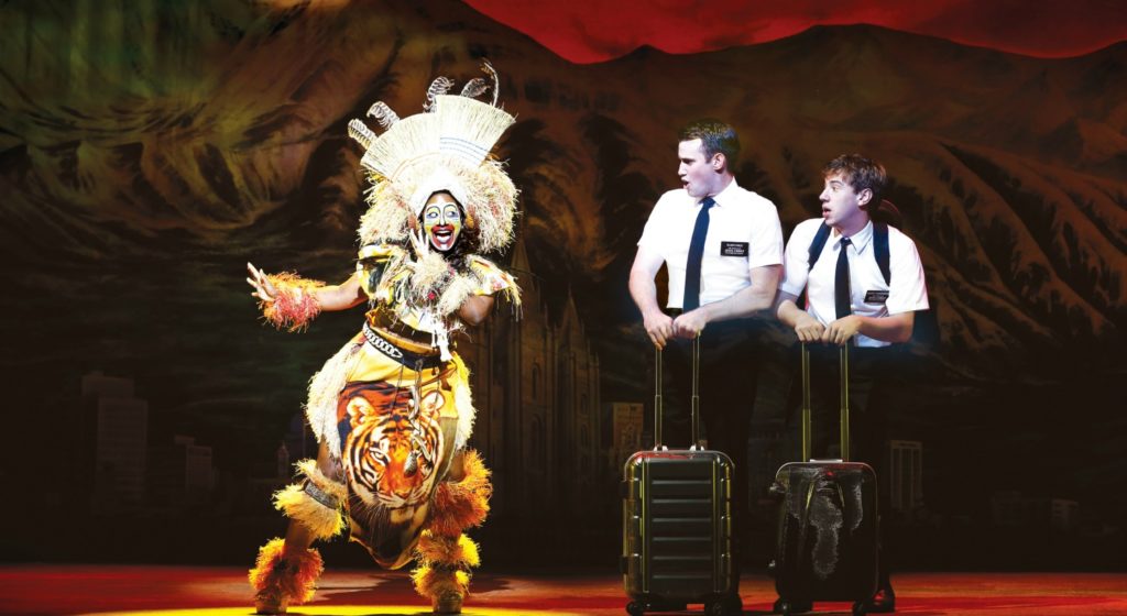 Phyre Hawkins as Mrs Brown, Ryan Bond and A.J.Holmes in the Book of Mormon. © Jeff Busby