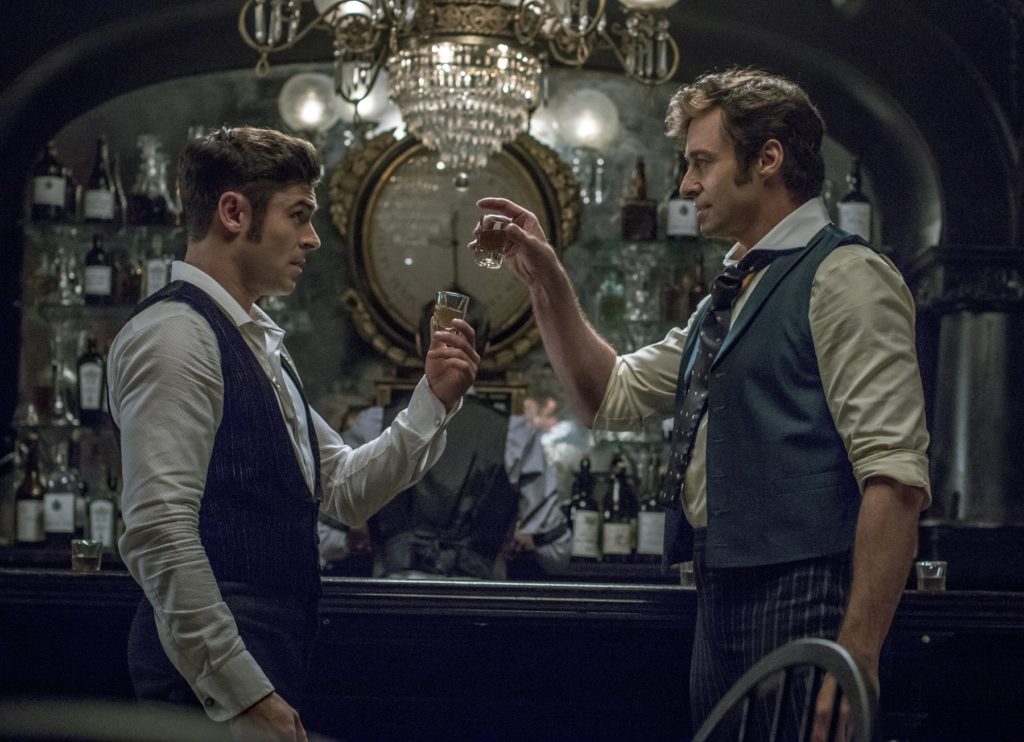 Zac Efron and Jackman in the bar scene.